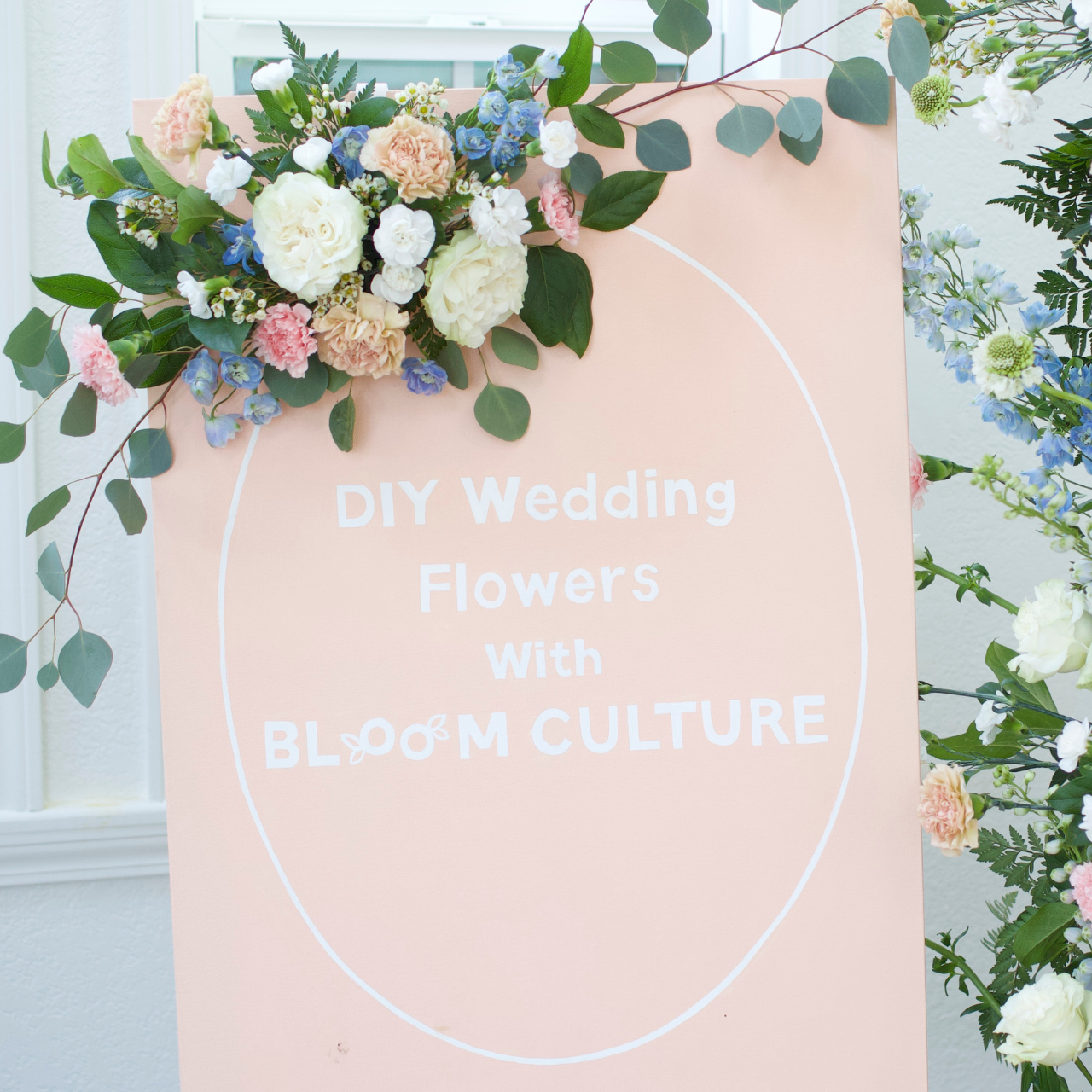 How to Put Flowers on Wedding Signage